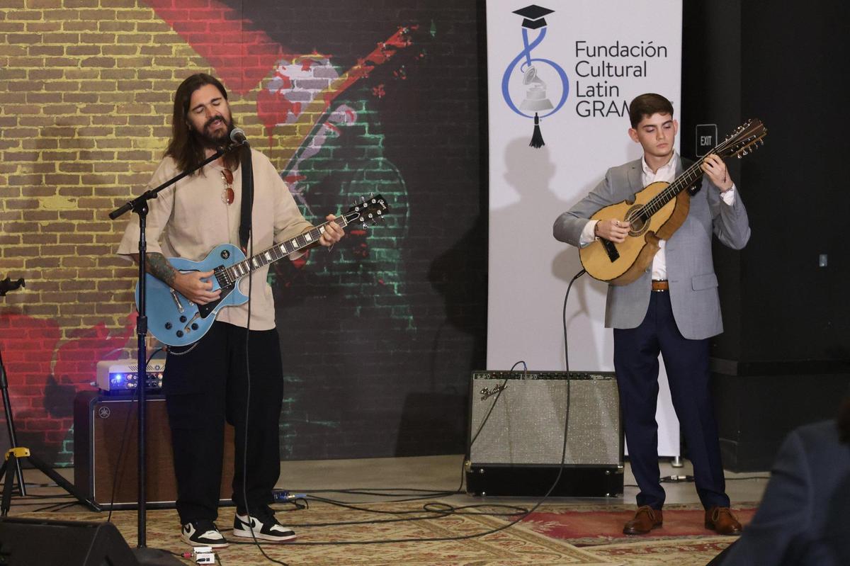 2019 Latin Recording Academy Person of the Year recording artist Juanes performs with the winner of Juanes Scholarship, Xavier Cintrón, right, on Tuesday, July 13, 2021, in Miami..