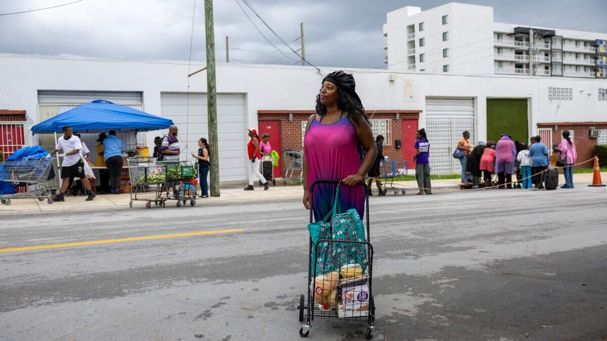 Jacolbia McGinnis stands in front of Curley's House Food Bank in Miami on Thursday, June 4, 2026.