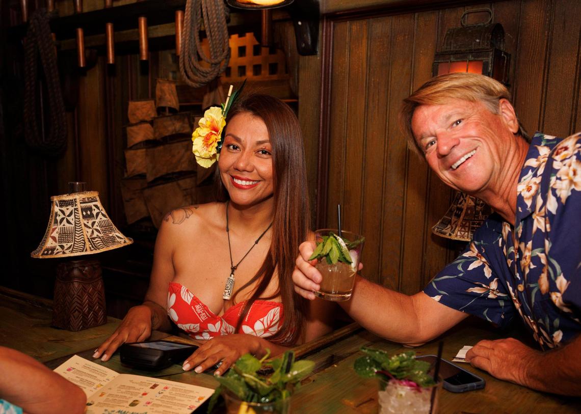 Jack Keyser, right, poses with one of his favorite bartenders named Claudia during the reopening of Mai-Kai on Thursday, Nov. 21, 2024, at the restaurant in Fort Lauderdale.