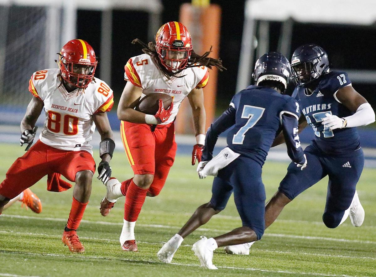 Deerfield Beach Bucks running back Jamaree Dukes (5) carries the ball against Palmetto Panthers during the Class A 8 Regional semifinal football game on Thursday, November 18, 2021 Tropical Park Stadium. Andrew Uloza / for THE MIAMI HERALD