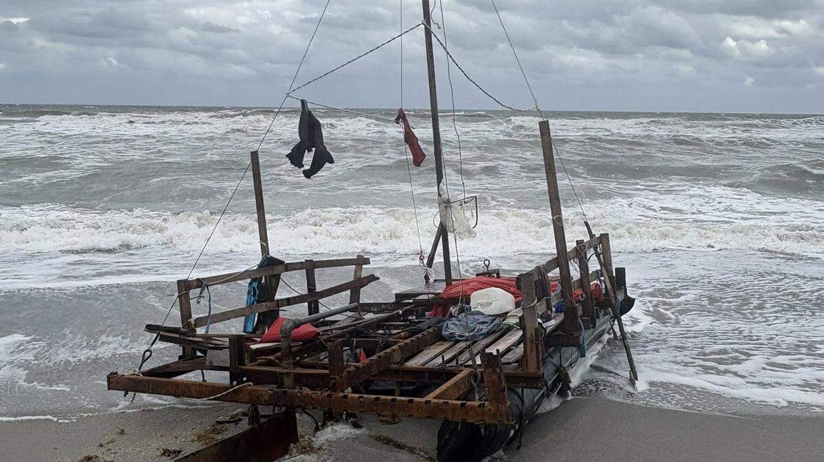 A makeshift migrant boat rests beached on Jupiter Island in Martin County Saturday, Oct. 25, 2025.