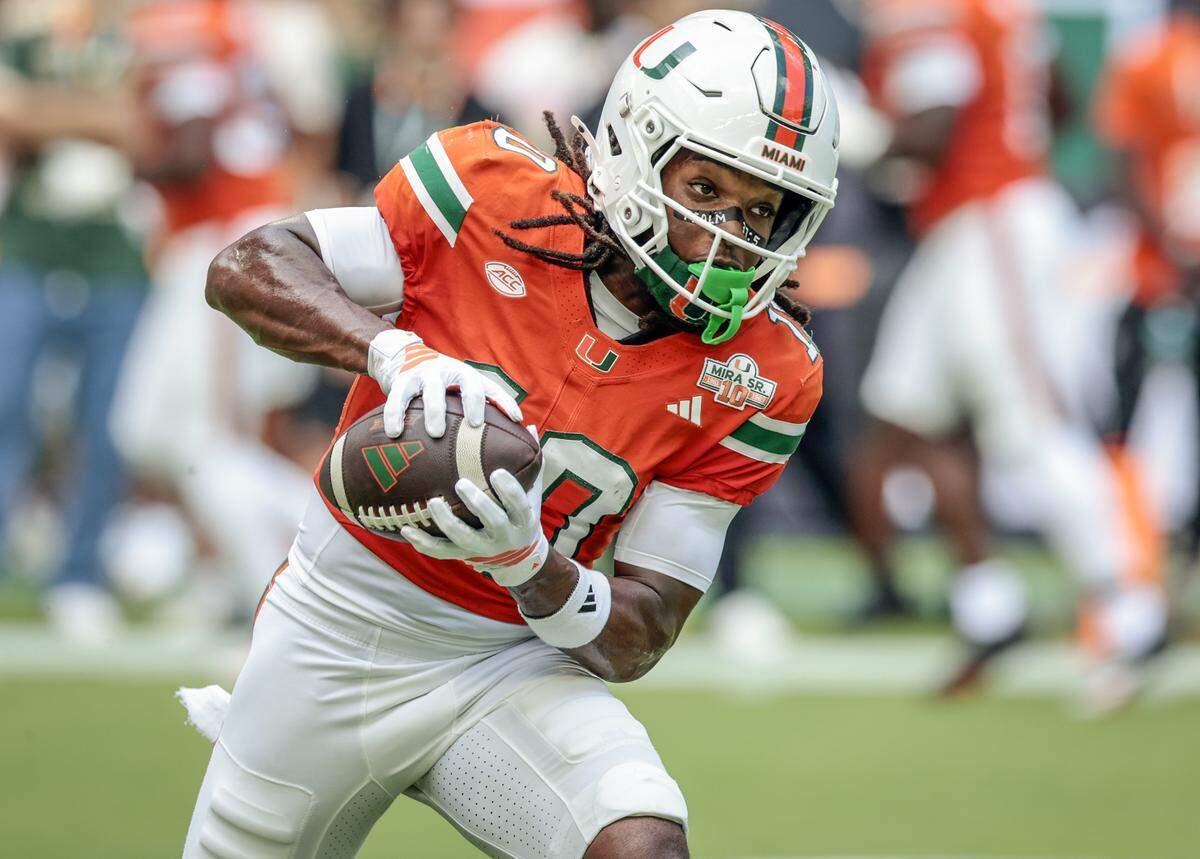 Miami Hurricanes wide receiver Malachi Toney (10) catches a pass during warmups before the NCAA football game against the South Florida Bulls at Hard Rock Stadium in Miami Gardens, Florida, on Saturday, September 13, 2025.