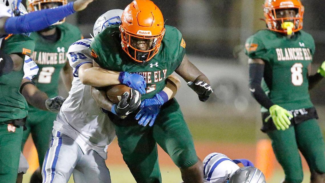 Blanche Ely Tigers Lerry Moise (81) is tackled by Fort Lauderdale Flying L’s defenders during football game on Friday, September 30, 2022 at Blanche Ely HS in Pompano Beach. The Tigers won 36-12.