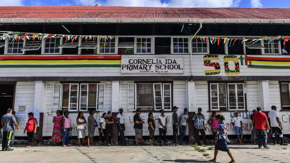 Guyanese citizens line up to vote in March in presidential elections, the results of which are still in dispute.