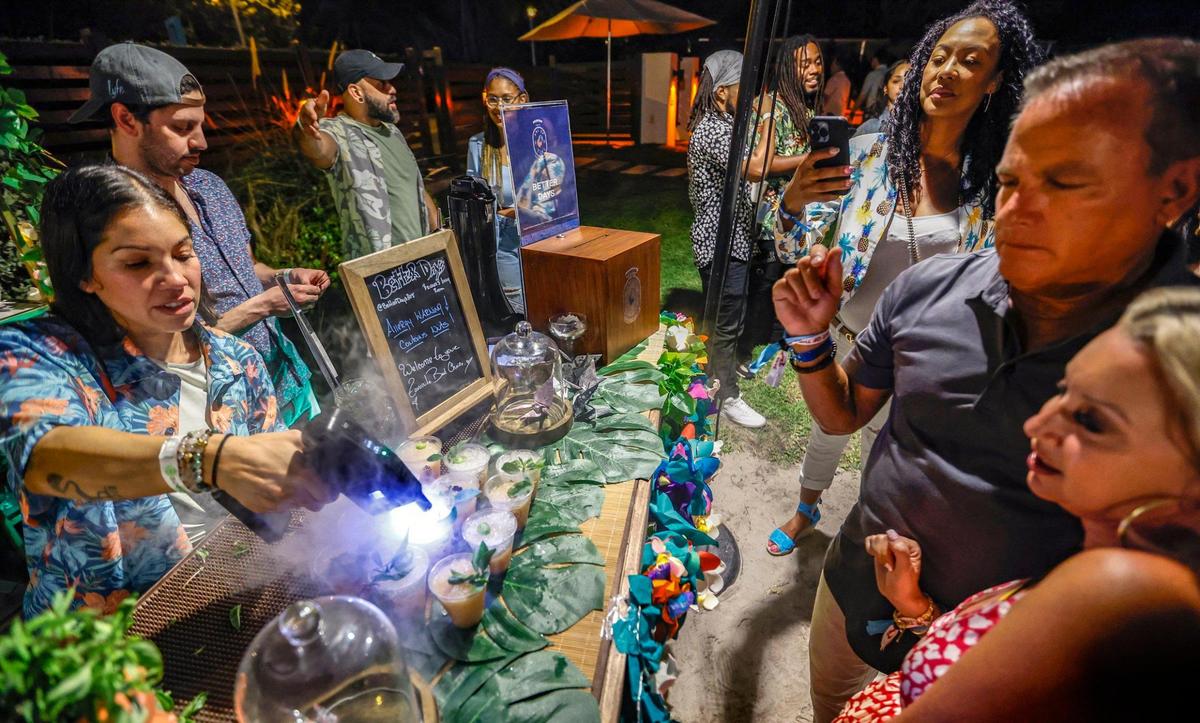 Lexi Tollinchi, with Better Days, prepares cocktails for guests during the Art of Tiki Cocktail Showdown at the South Beach Wine & Food Festival at the Kimpton Surfcomber Hotel in Miami Beach, Florida on Saturday, February 25, 2023.