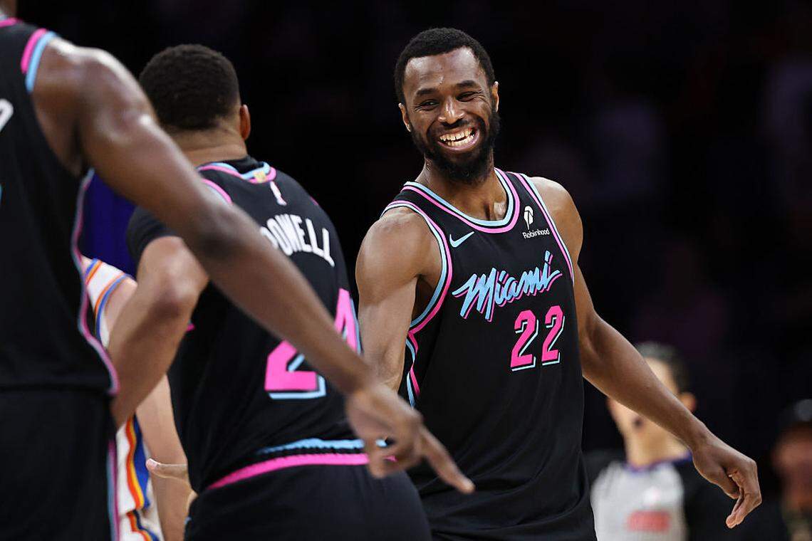 Andrew Wiggins #22 of the Miami Heat celebrates a basket with Norman Powell #24 against the Oklahoma City Thunder during the second half at Kaseya Center on January 17, 2026 in Miami.