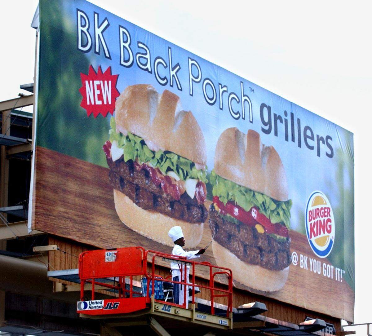 5/30/02 Photo by Tim Chapman/Herald Staff (Miami) Thur. Bill Barrier (cq), waves from a billboard off US One at SW 102nd Street to intorduce a new sandwich, the “BK Back Porch griller” (cq) as a promtion. For business.