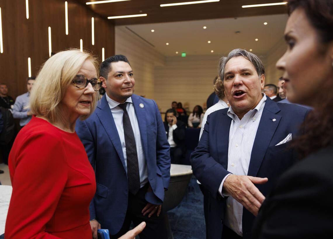 Rubén Rodríguez, CEO of MSC Group’s North American cruise division, second from right, introduces Miami Mayor Eileen Higgins, left, to members of his staff before a ribbon cutting ceremony on Monday, Jan. 26, 2026, at Block 55 at Sawyer's Walk in Miami, Fla.