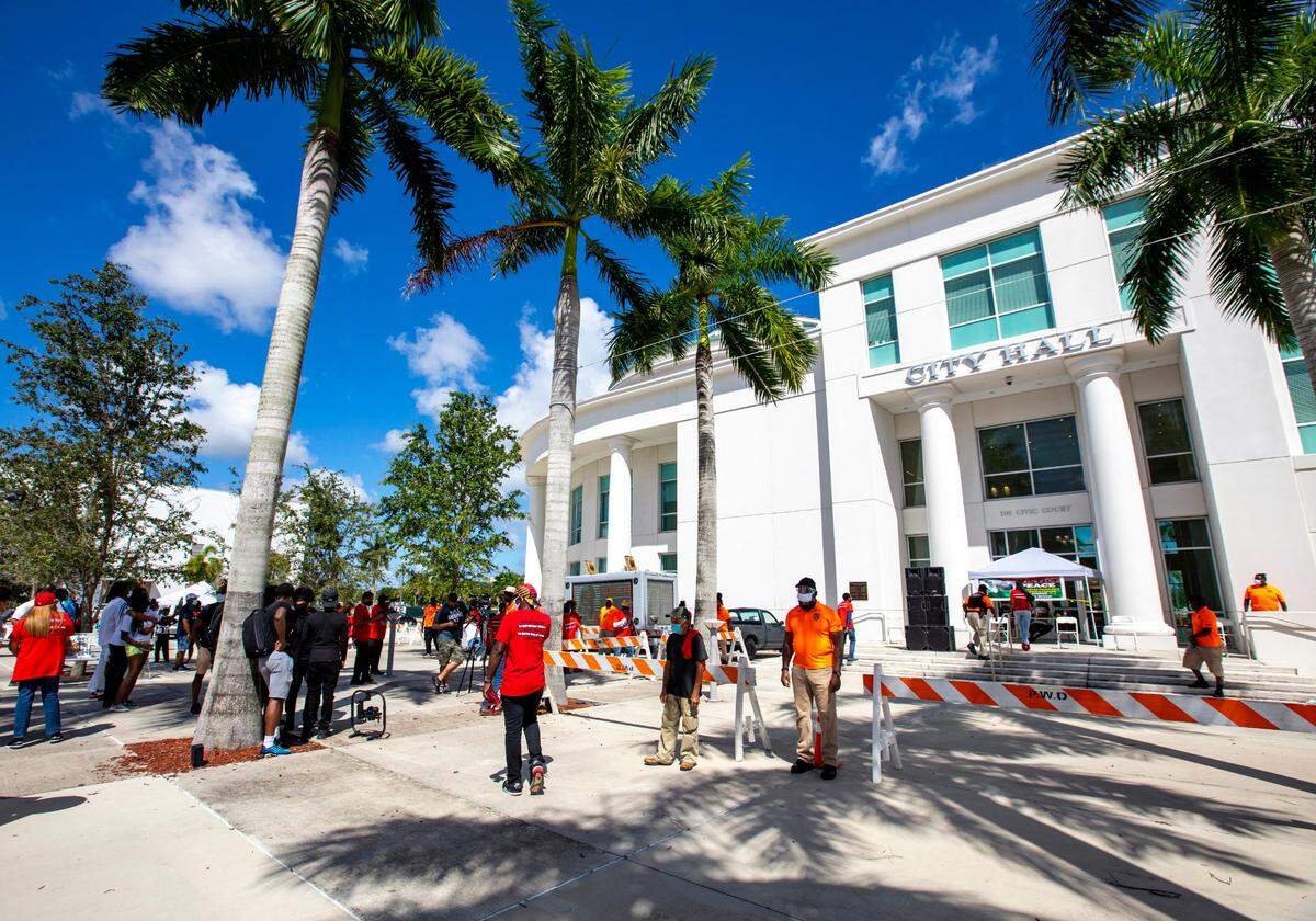 People gather during a protest event held to shed light on the death of Edward Foster II at the hands of a Homestead police officer in 2015 as well as help get Melba Pearson elected as State Attorney at City Hall in Homestead, Florida on Sunday, July 19, 2020.
