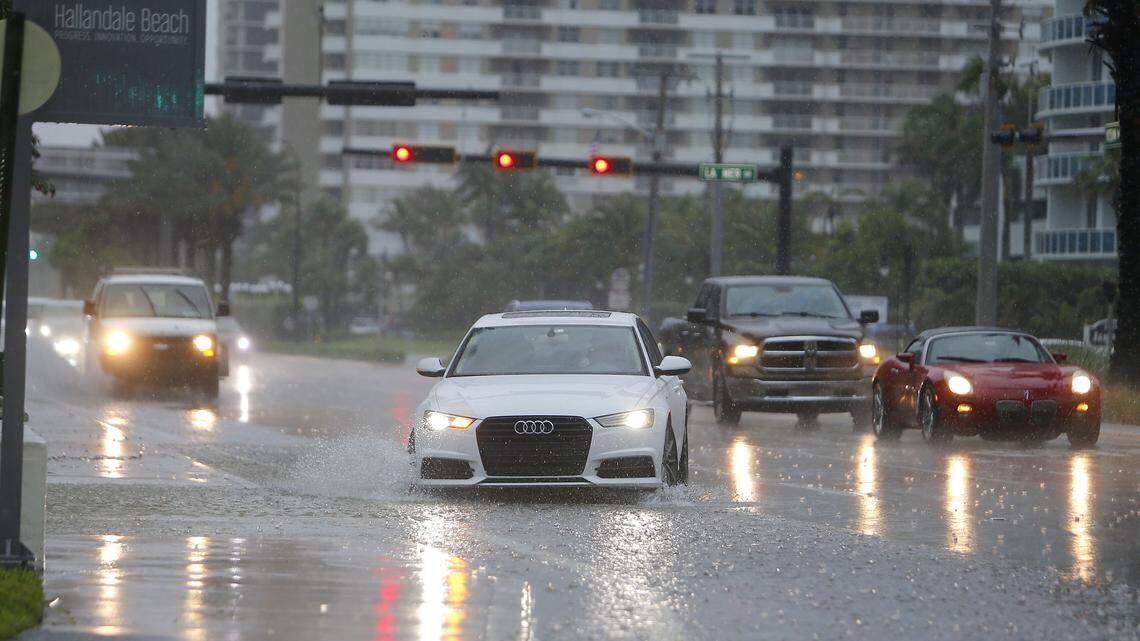 Rainy season returns: Cars driving through stormy streets in Hallandale.