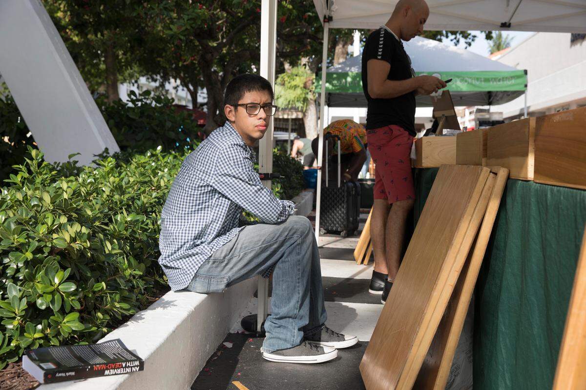 Mathew Yeary, 18, a vendor on Lincoln Road in Miami Beach registered to vote on Sunday, June 24, 2018 thanks to actvists from March for Our Lives. Student activist from Marjory Stoneman Douglas High School and March for Our Lives, searched for unregistered voters on Lincoln Road in Miami Beach. The group’s South Beach event was the first stop on the Florida leg of their “Road to Change” tour,  where they aim to educate Floridians, across all 27 congressional districts about gun violence, and register voters before mid-term elections.  
