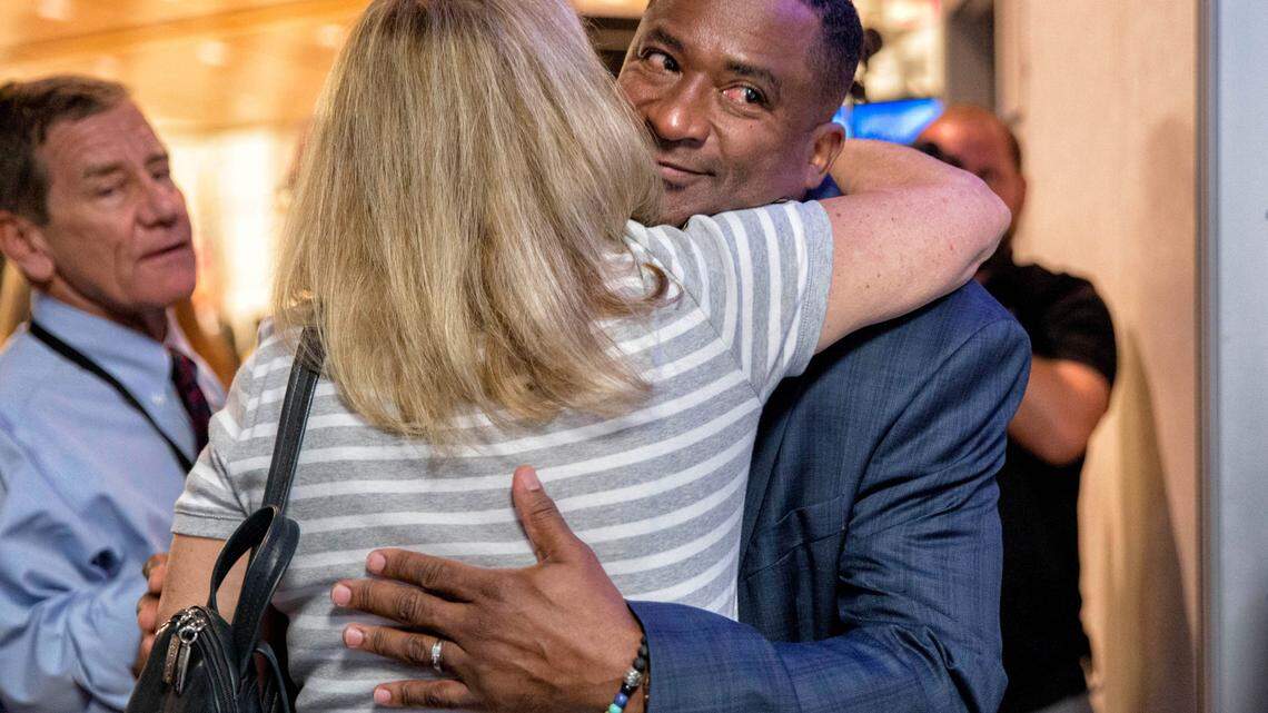 Former Spanish River High School Principal William Latson gets a hug after Palm Beach County school board members, in a 5-2 vote, voted to fire him on Oct. 30, 2019. Latson had refused to say the Holocaust was a “factual, historical event.