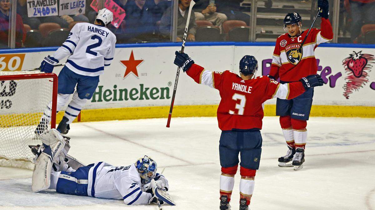 Florida Panthers defenseman Keith Yandle (3) and center Aleksander Barkov (16) celebrate after Barkov scores in the first period as the Florida Panthers host the aToronto Maple Leafs at the BB&T Center in Sunrise on Saturday, December 15, 2018.