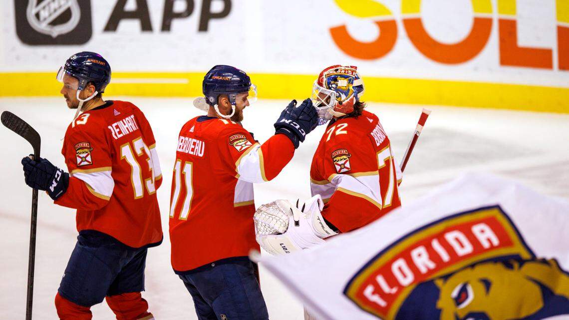 Florida Panthers players Sergei Bobrovsky (72) Jonathan Huberdeau (11) and Sam Reinhart (13) celebrate their 5-2 win over the Detroit Red Wings during an NHL game at the FLA Live Arena on Thursday, April 21, 2022 in Sunrise, Fl.