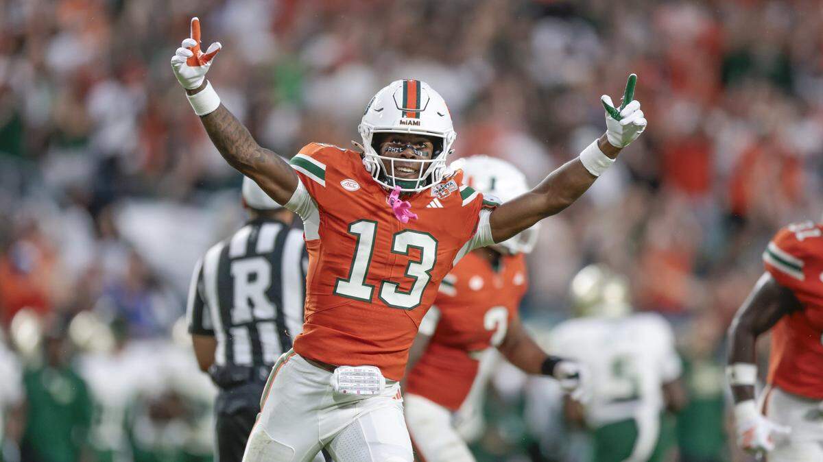 Miami Hurricanes defensive back Bryce Fitzgerald (13) reacts after an interception against the South Florida Bulls during their NCAA football game at Hard Rock Stadium in Miami Gardens, Florida, on Saturday, September 13, 2025. 