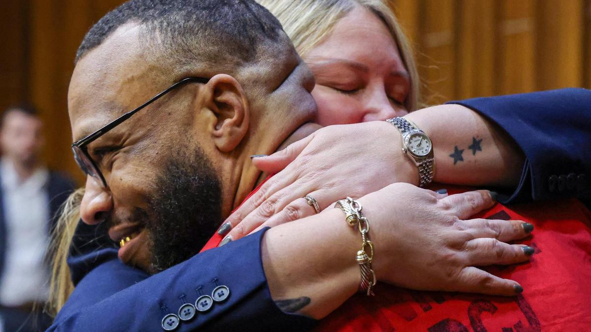 Miami convicted murderer Corey Smith, left, is embraced by his attorney Allison Miller after Miami-Dade prosecutors vacated his four Death Row murder convictions in exchange for him pleading guilty to several counts of second-degree murder and manslaughter, Courtroom 4-1 at the Richard E. Gerstein Justice Building in Miami, Florida, on Wednesday, Feb. 5, 2025.