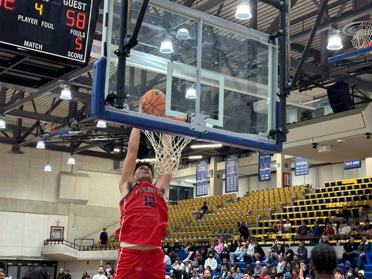 Columbus’ Cameron Boozer dunks the ball on Friday during a 62-44 win over Riviera Prep at the Miami-Dade College Kendall campus gym.