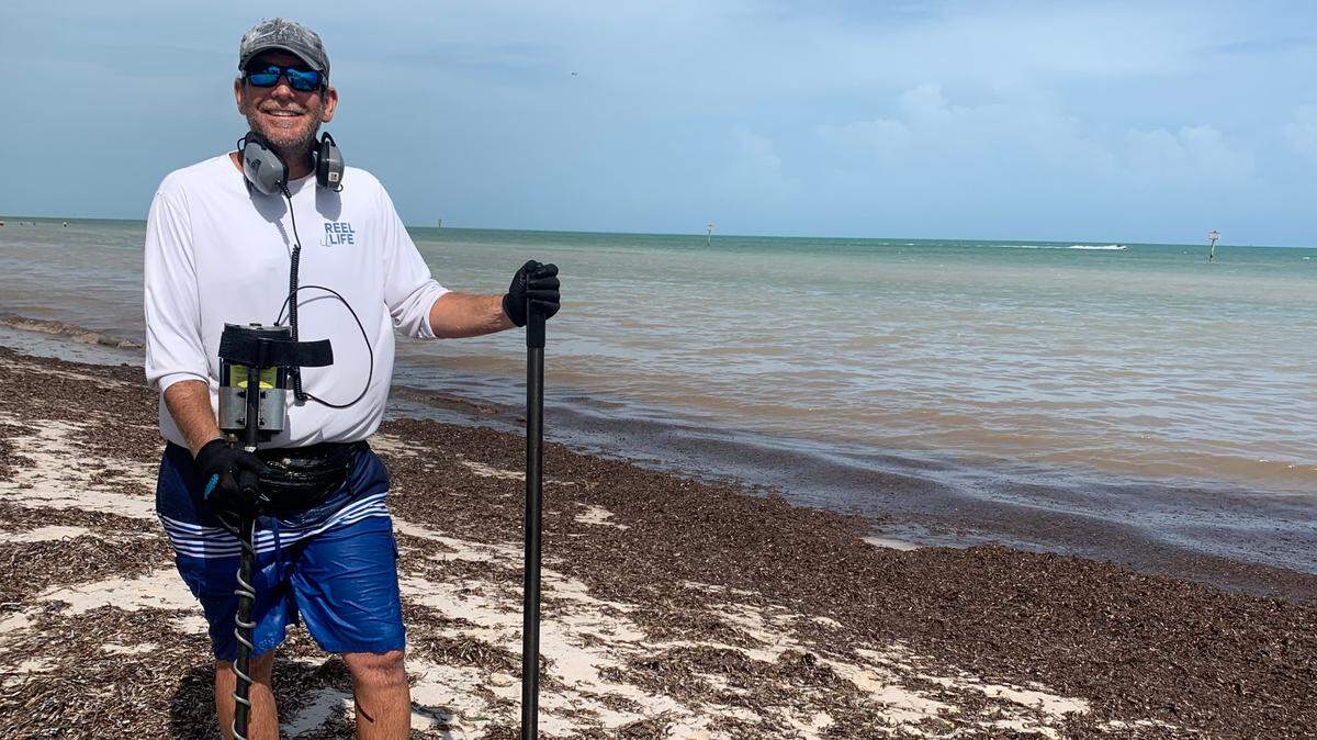 Alex Corpion, of Key West, often searches for treasure like lost rings at Smathers Beach with a metal detector.