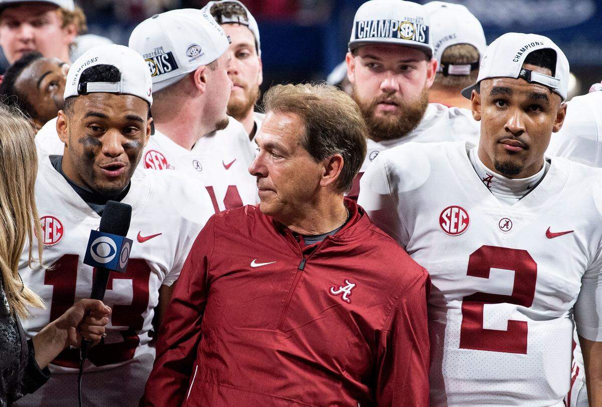 Alabama quarterback Tua Tagovailoa (13), head coach Nick Saban and quarterback Jalen Hurts (2) are interviewed after defeating Georgia in the SEC Championship Game at Mercedes Benz Stadium in Atlanta, Ga., on Saturday December 1, 2018. Saban1306