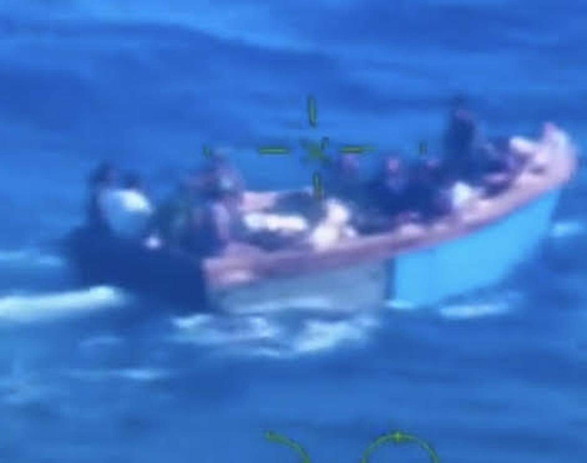 Aerial footage taken from a Coast Guard plane shows a migrant boat about 40 miles off Key West Monday, April 24, 2023.