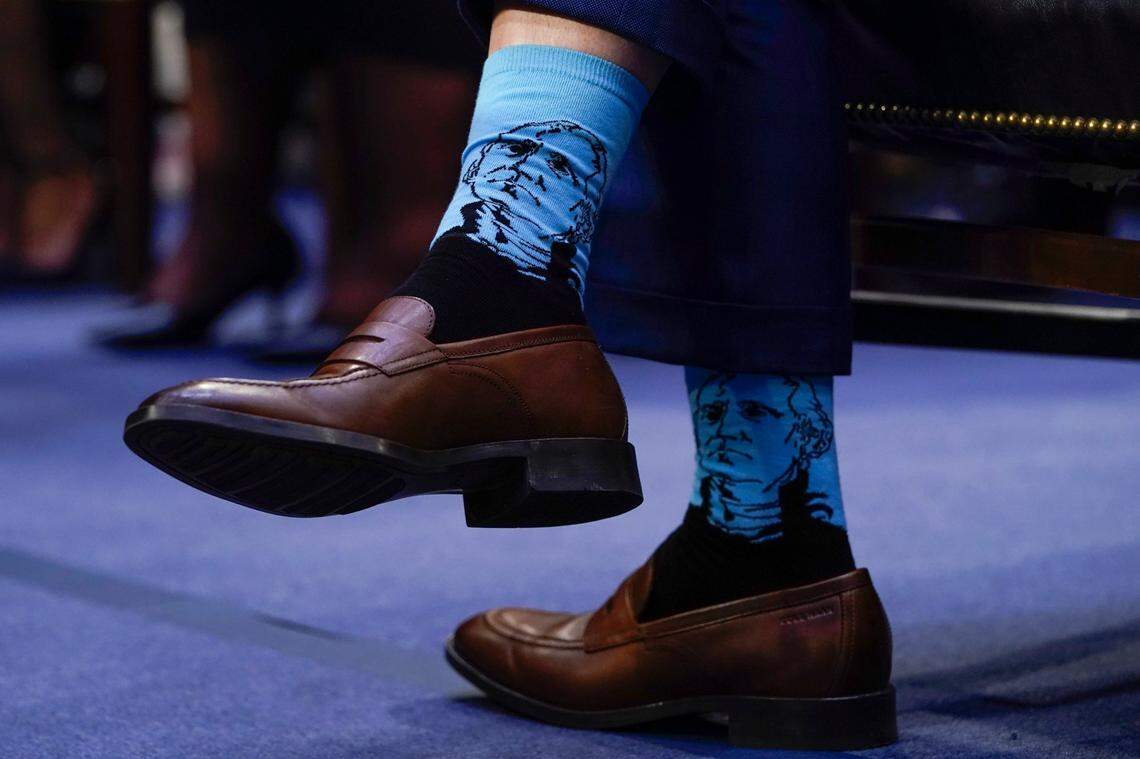 Dr. Patrick Jackson, husband of Supreme Court nominee Ketanji Brown Jackson, wears socks with the likeness of President George Washington during her confirmation hearing before the Senate Judiciary Committee Monday, March 21, 2022, on Capitol Hill in Washington.