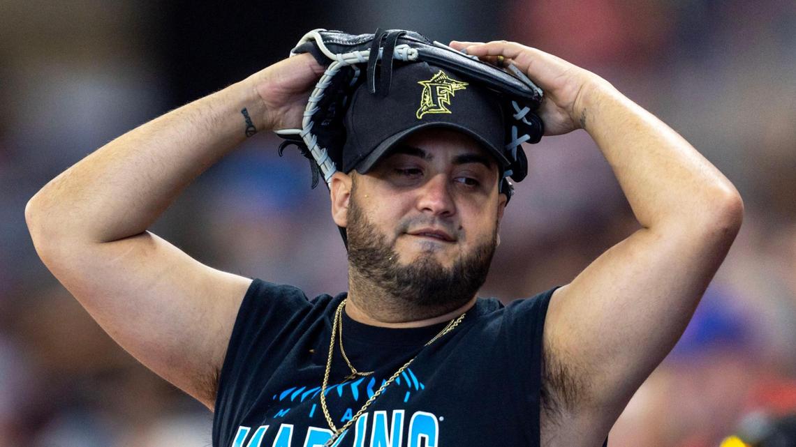 A Marlins fan reacts to a play during the sixth inning of an MLB game against the New York Mets at LoanDepot Park in Miami, Florida, on Thursday, March 30, 2023.