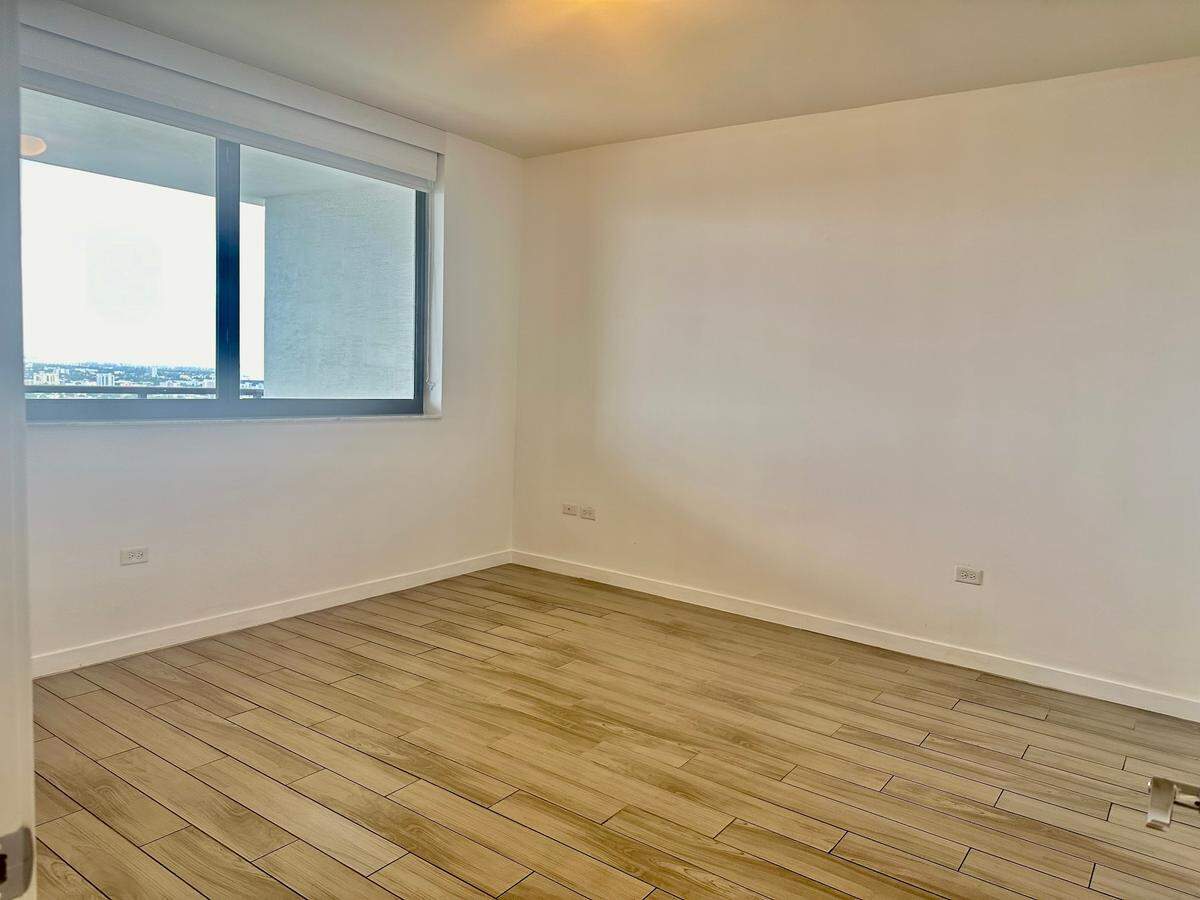 The one-bedroom, one-bathroom apartment looks over the downtown Miami skyline. In the distance, renters can see a slice of Biscayne Bay.