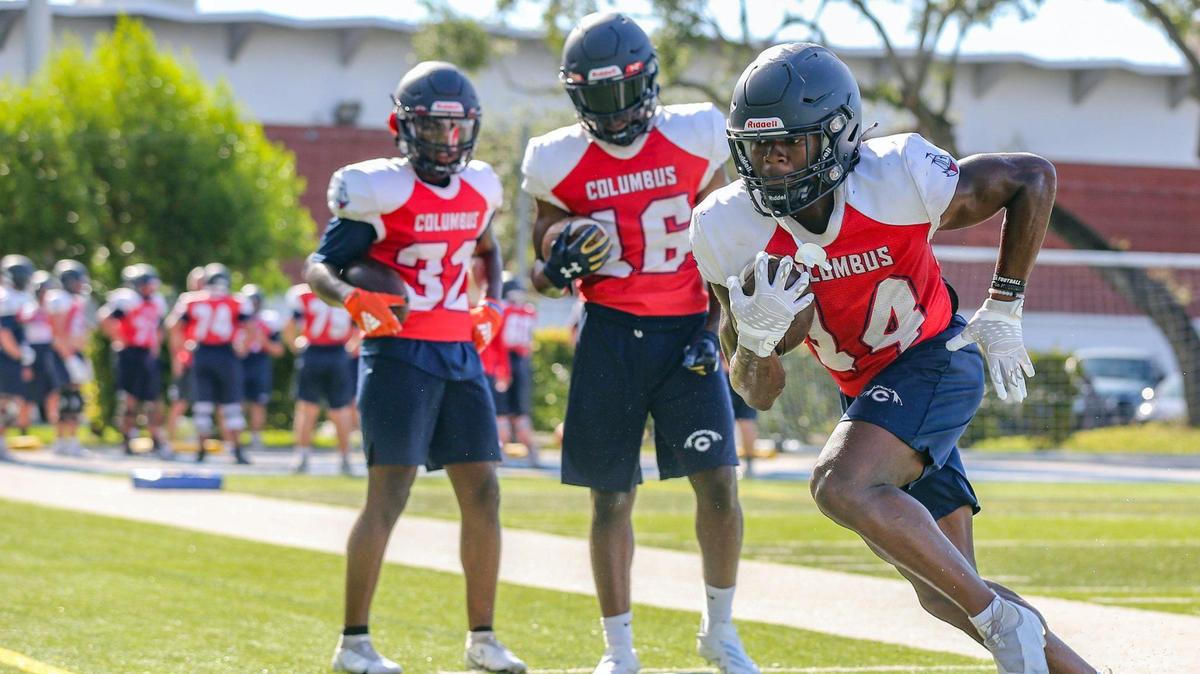 Christopher Columbus High School running back Sedrick Irvin Jr. (14) runs during a recent practice. Irvin Jr. is a Stanford University commit.