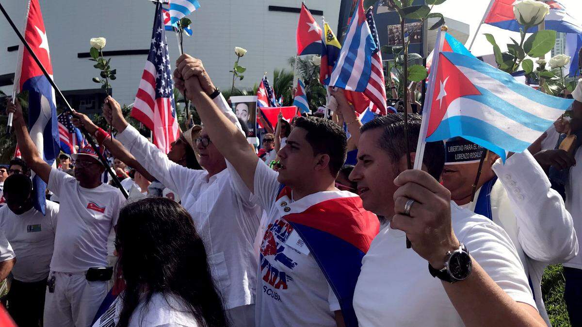 Dozens of Cubans wave the national flag during a demonstration in support of Cuba, near the Freedom Tower, in Miami on Nov. 1, 2021.