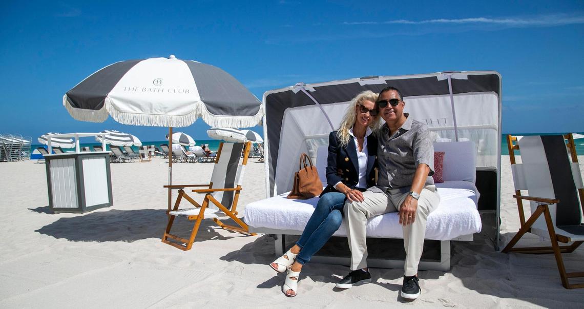 Developer Don Peebles and his wife, Katrina, pose on the beach at the Bath Club in Miami Beach. Peebles has restored and reopened the historic private club after years of use as an event space.