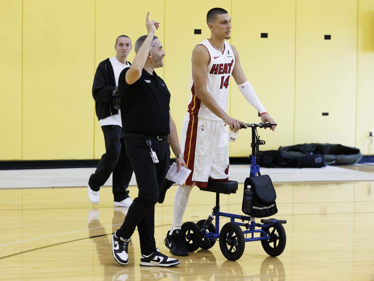 Tyler Herro (14) uses his scooter during the Miami HEAT Media Day on Monday, Sept. 29, 2025, at the Kaseya Center in downtown Miami, Fla. 