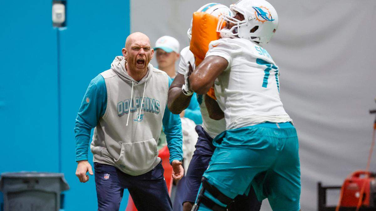 Miami Dolphins offensive line coach Butch Barry works with players during practice at Miami Dolphins Training Camp in Miami Gardens, Florida, on Wednesday, July 23, 2025.