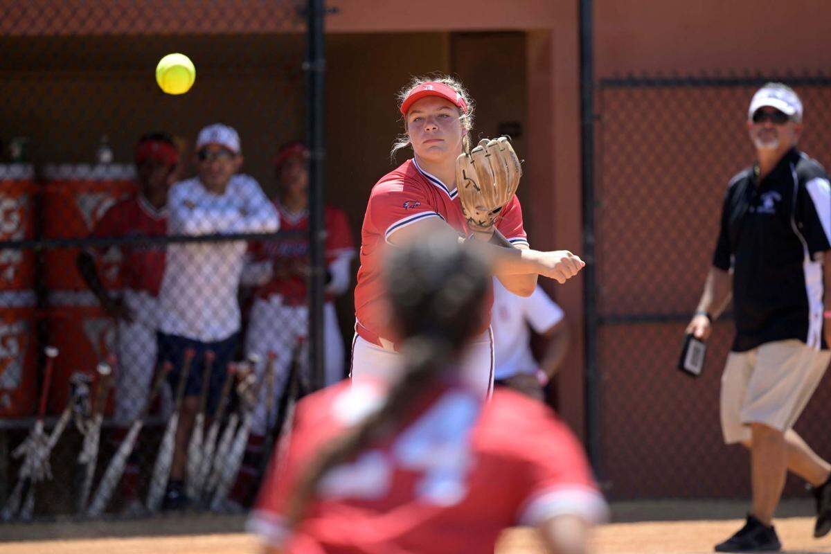 Doral Academy third baseman Sarah Breaux gets the out at first base after fielding a ground ball by Melbourne’s Ally Turner during the first inning of an FHSAA State Championship Softball Game, Saturday, May 28, 2022, in Clermont, Fla. (Phelan M. Ebenhack for the Miami Herald)