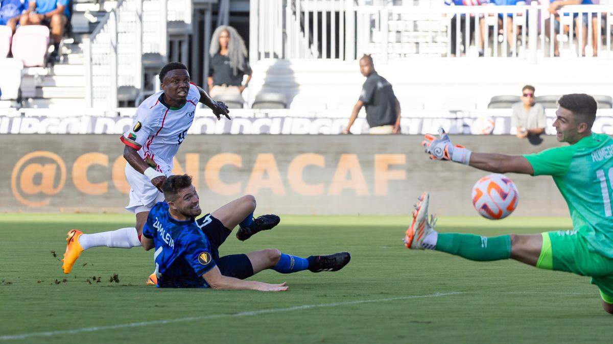 Martinique defender Patrick Burner (15) scores a goal as El Salvador goalkeeper Tomas Romero (18) fails to block the shot in the first half of their CONCACAF Gold Cup 2023 match at DRV PNK Stadium on Monday, June 26, 2023, in Fort Lauderdale, Fla.
