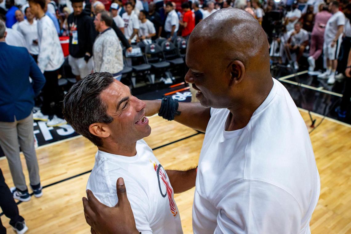 Mayor of Miami Francis X. Suarez, left, and former NBA player, Jamal Mashburn, right, say hello to one another on the court after the fourth quarter of Game 1 of the NBA Eastern Conference Finals series between the Miami Heat and the Boston Celtics at FTX Arena in Miami, Florida, on Tuesday, May 17, 2022.
