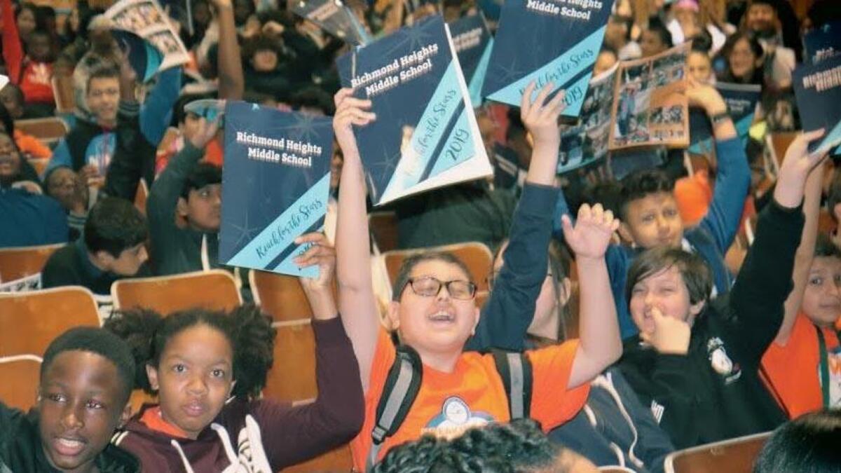 Richmond Heights Middle School students celebrate finally having a school yearbook, the first one in seven years.