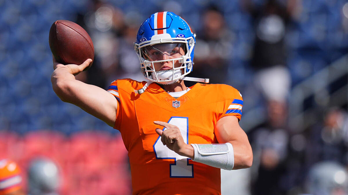 Oct 6, 2024; Denver, Colorado, USA; Denver Broncos quarterback Zach Wilson (4) warms up before the game against the Las Vegas Raiders at Empower Field at Mile High. Mandatory Credit: Ron Chenoy-Imagn Images
