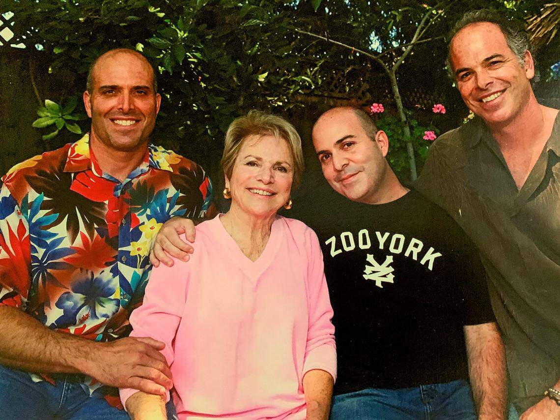 Mary Jane Farmanian stands with her three sons, Greg, Doug and Mike Farmanian.