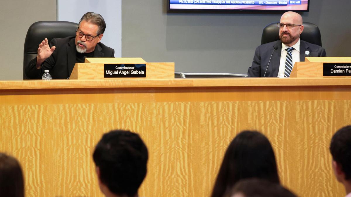 Commissioner Miguel Gabela, left, speaks in support of holding a special election and Commissioner Damian Pardo, right, who also advocated for a special election, listens during a meeting to decide how to fill the seat vacancy of Manolo Reyes on Thursday, April 17, 2025, at Miami City Hall in Coconut Grove. The council voted unanimously to hold a special election, proposed to be June 3, to fill the seat.