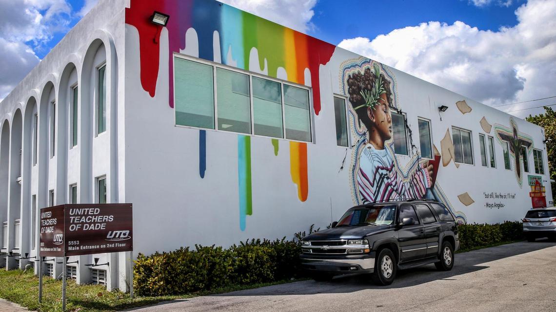 The Miami Springs City Council held a special meeting Wednesday night to vote on whether to ask the United Teachers of Dade, the union for MIami-Dade public school teachers, to remove a mural painted on the union’s headquarters at 5553 NW 36th St. The city contends the mural did not follow the city’s approved color palette, which stipulates that no more than three approved colors can be used to paint a building. The union maintains the mural improves a largely neglected part of the city.