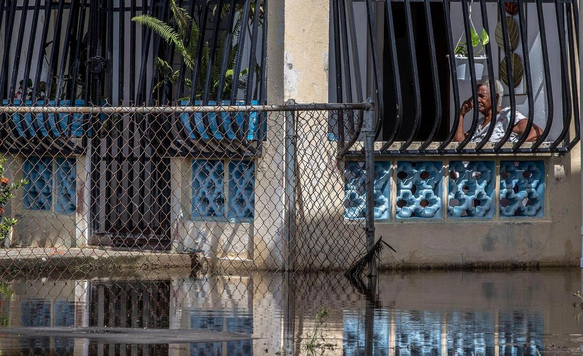 Zoraida Fuentes seats in her porch surrounded by water left by Hurricane Fiona’s heavy rain that flooded the Miñi Miñi neighborhood in the town of Loíza on the northeastern coast of Puerto Rico as the hurricane passed by the island on Monday September 18, on Wednesday, September 21, 2022.
