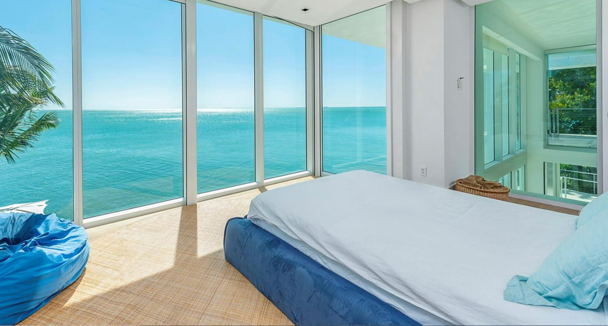 The 8,000-square-foot house at 440 S. Mashta Dr. on Key Biscayne has five bedrooms, five bathrooms and a half bath. Above: One of the house’s guest rooms.