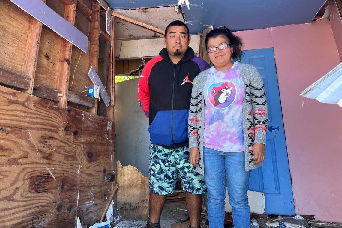 Eulogio and Lisa Martinez stand in what used to be their child’s bedroom.