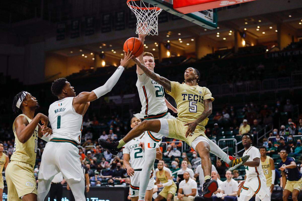 Miami Hurricanes guard Harlond Beverly (5) attempts a layup shot ahead of Miami Hurricanes forward Sam Waardenburg (21) during the second half of a basketball game at the Watsco Center in Coral Gables, Florida on Wednesday, February 9, 2022.