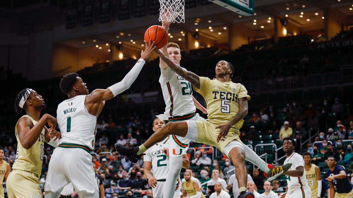 Miami Hurricanes guard Harlond Beverly (5) attempts a layup shot ahead of Miami Hurricanes forward Sam Waardenburg (21) during the second half of a basketball game at the Watsco Center in Coral Gables, Florida on Wednesday, February 9, 2022.