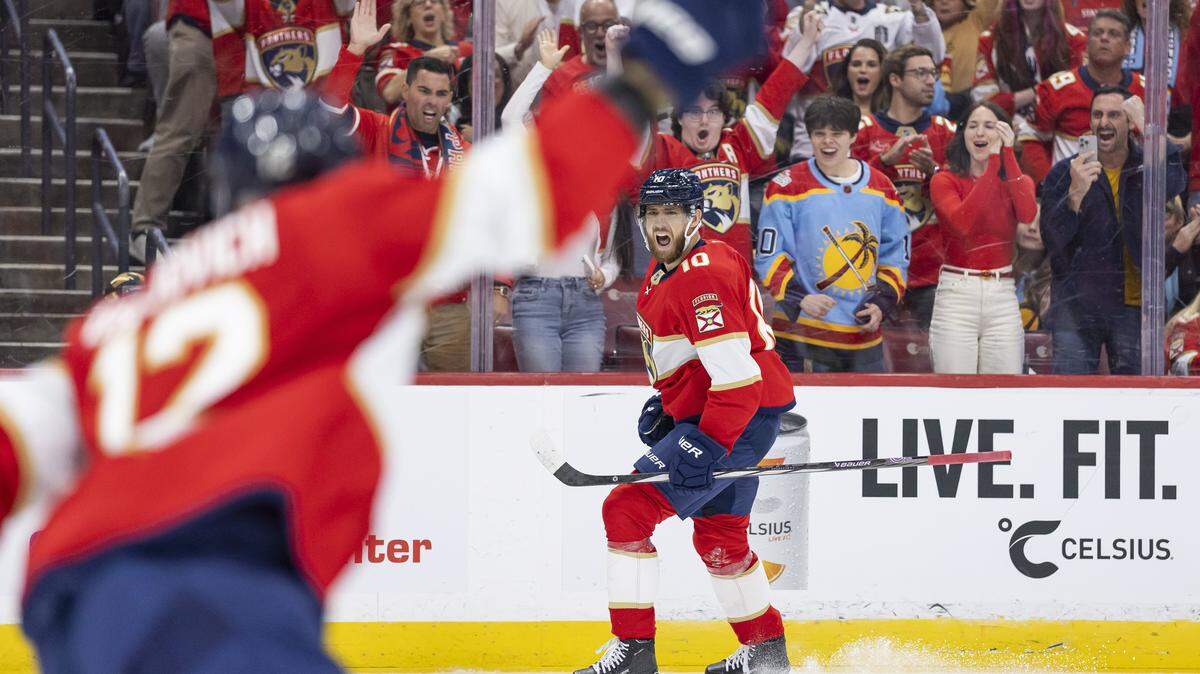 Florida Panthers left wing A.J. Greer (10) reacts after scoring against Chicago Blackhawks goaltender Spencer Knight (30) in the first period of their NHL game at Amerant Bank Arena on Tuesday, Oct. 7, 2025, in Sunrise, Fla.