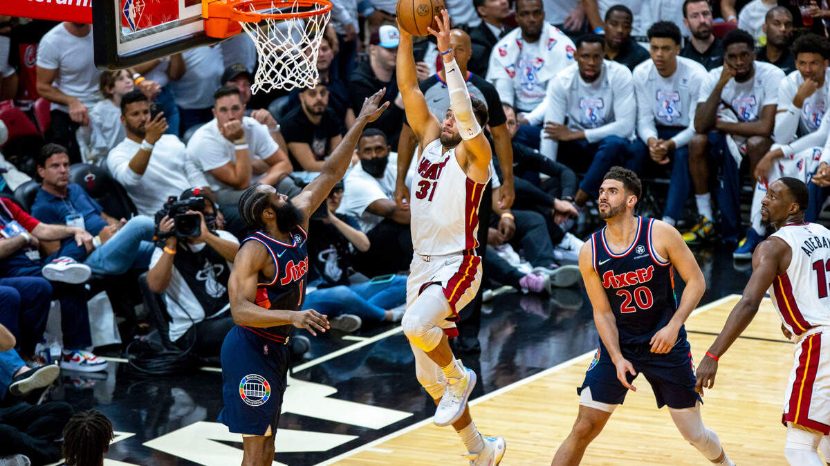 Miami Heat forward Max Strus (31) dunks over Philadelphia 76ers guard James Harden (1) during the fourth quarter of Game 1 of a second round NBA Eastern Conference semifinal playoff series at FTX Arena in Miami, Florida, on Monday, May 2, 2022.