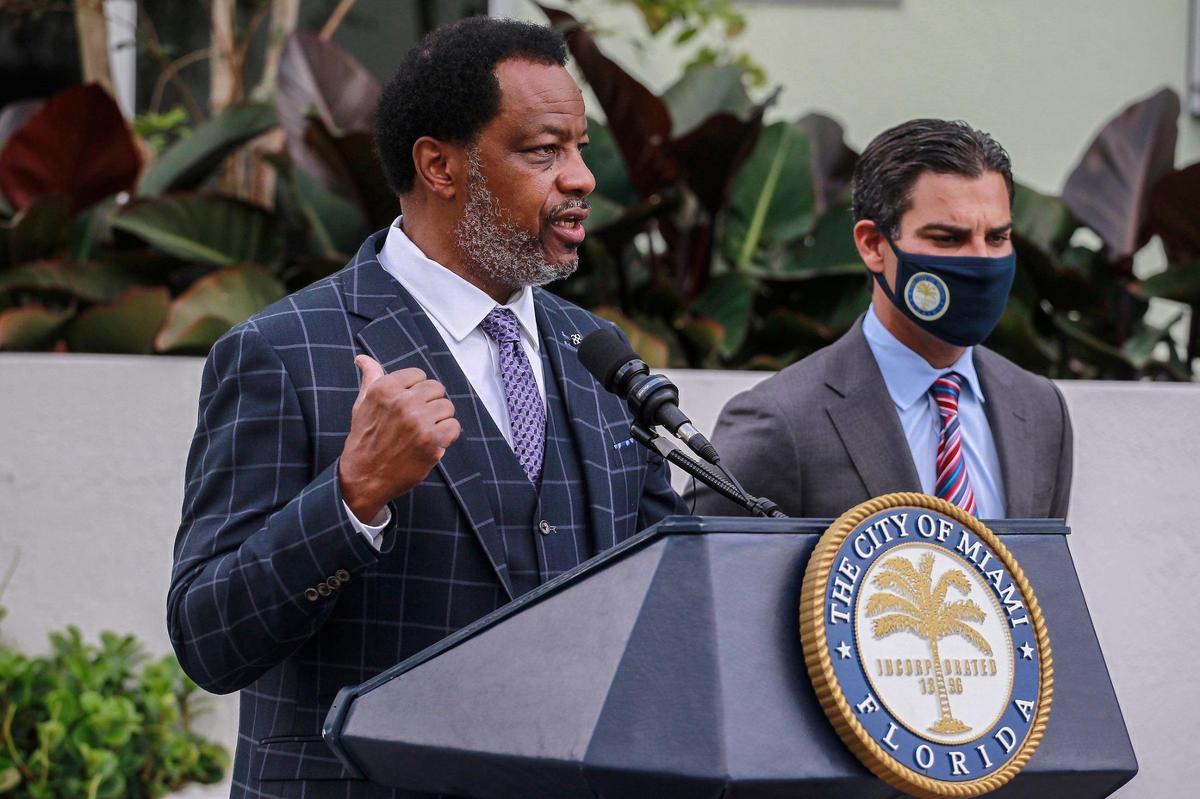Commissioner Jeffrey Watson, left, speaks about his initiative to help vaccinate all city residents, especially Black Miamians, as Miami Mayor Francis Suarez stands beside him at Wednesday’s press conference at Tuscany Cove Apartments in Miami’s Liberty City neighborhood.