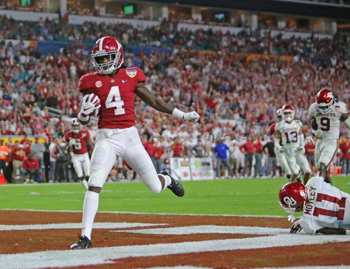 Alabama Crimson Tide wide receiver Jerry Jeudy (4) scores a touchdown against the defense of Oklahoma Sooners cornerback Parnell Motley (11) during fourth quarter of the College Football Playoff Semifinal at the Orange Bowl game at Hard Rock Stadium on Saturday, December 29 2018, in Miami Gardens.