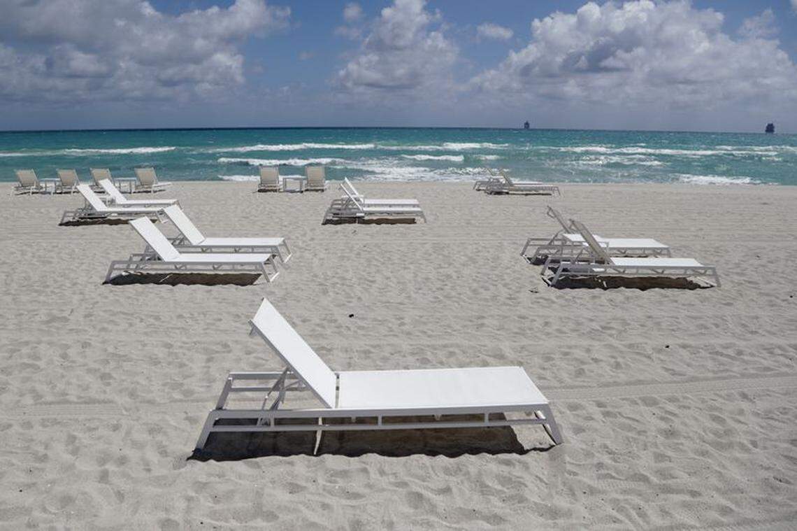 Empty chairs sit on the sand in Miami Beach in March.